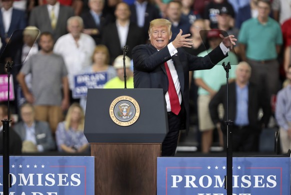 epa06985863 US President Donald J. Trump speaks to his supporters during a rally at the Ford Center in Evansville, Indiana, USA, 30 August 2018. Trump is appearing at several Make America Great Again  ...