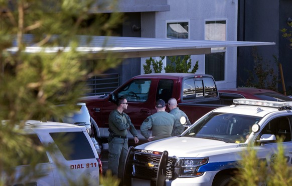 Henderson Police officers are shown at the scene of a fatal shooting in an apartment complex in Henderson, Nev. Tuesday, Nov. 3, 2020. Four people are dead including a possible suspect in the shooting ...