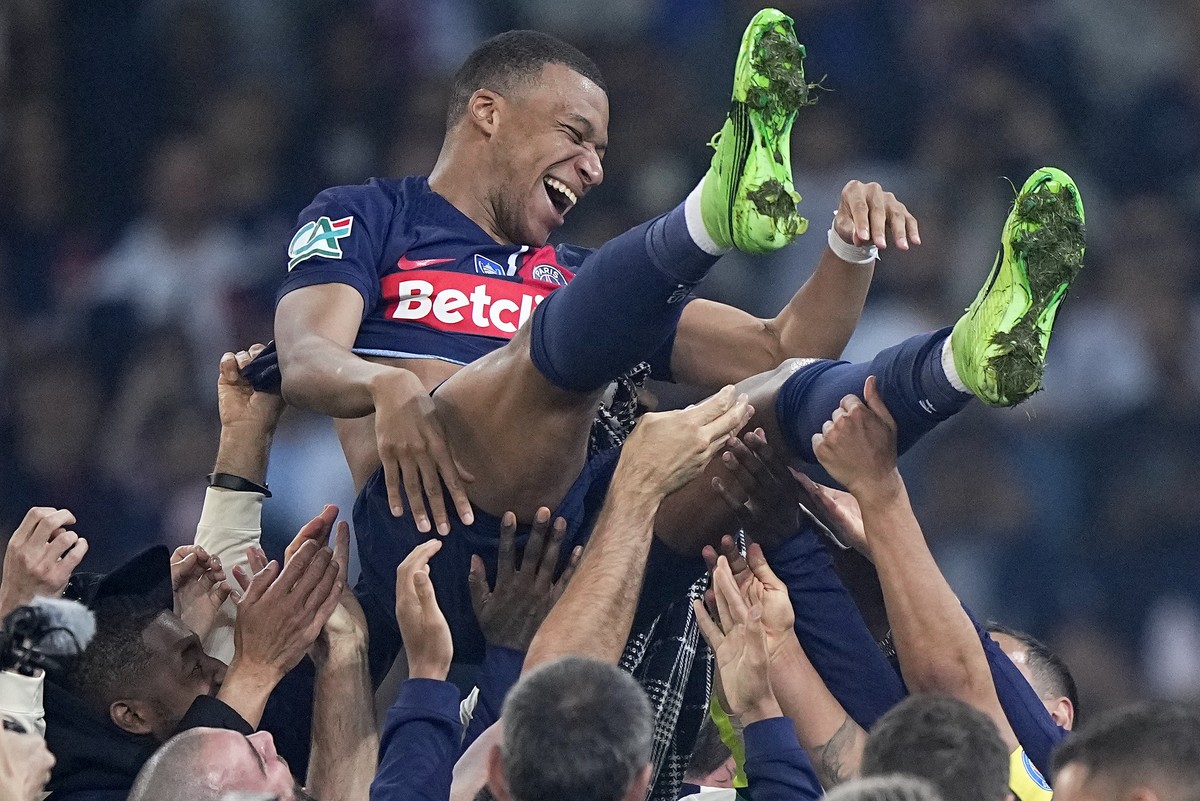 PSG's Kylian Mbappe is tossed into the air as he celebrates with teammates after the French Cup final soccer match between Lyon and PSG at the Pierre Mauroy stadium in Villeneuve d'Ascq, nor ...