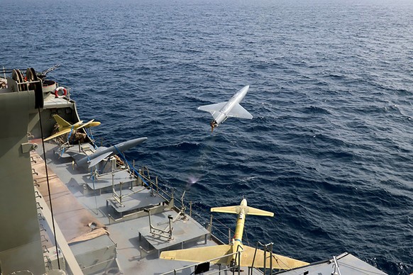 FILE - In this photo released by the Iranian Army on Aug. 25, 2022, a drone is launched from a warship in a military drone drill in Iran. The Iranian-made drones that Russia sent slamming into central ...