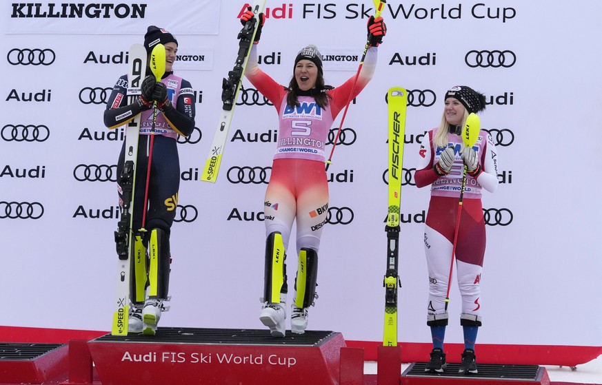 First place finishers Sweden&#039;s Anna Swenn Larsson, left, and Switzerland&#039;s Wendy Holdener, center, celebrate on the podium beside third place finisher Austria&#039;s Katharina Truppe after a ...