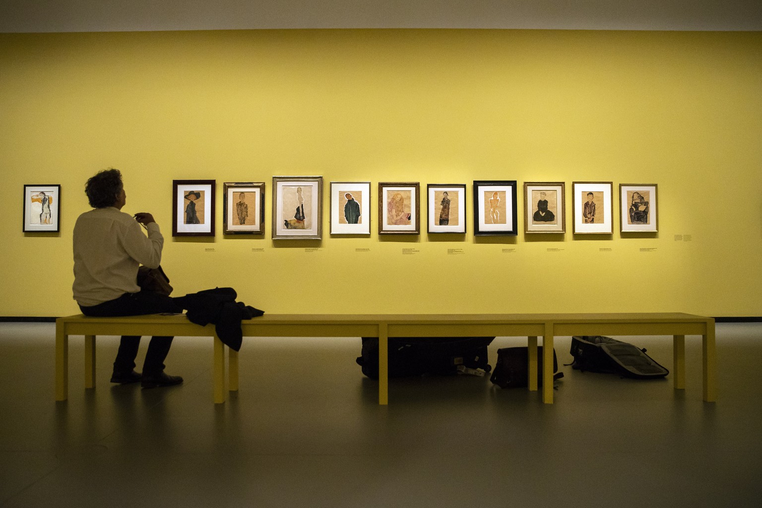 epa07063585 A visitor looks at paintings by Austrian artist Egon Schiele during the press opening of the double exhibition &#039;Basquiat - Schiele&#039; at the Fondation Louis Vuitton in Paris, Franc ...