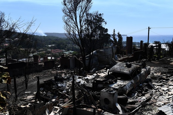 epa06613591 A view of a burned out area after more than 70 houses and businesses were destroyed by a bushfire in the coastal town of Tathra, New South Wales, Australia, 19 March 2018. Rural Fire Servi ...