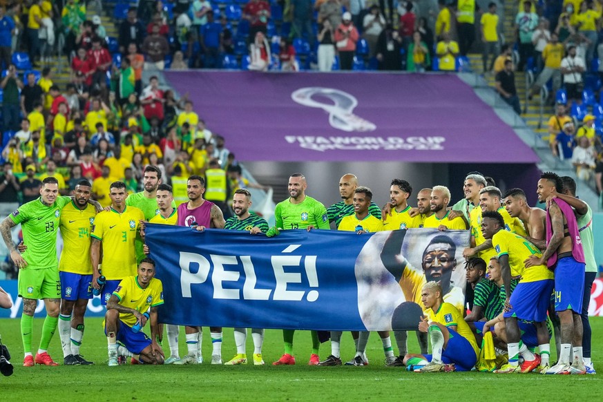 Brazil v South Korea: Round of 16 - FIFA World Cup, WM, Weltmeisterschaft, Fussball Qatar 2022 Photo group of team Brazil with baner for Pele the legend player of Brazil after won the match and qualif ...