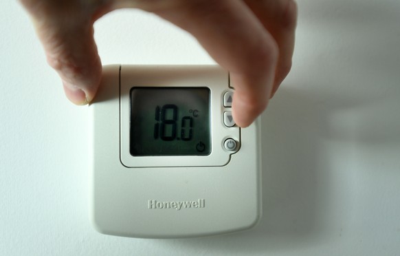 epa09863248 A central heating thermostat at a home in London, Britain, 01 April 2022. Household bills across the UK are to rise by by 90 euros a month, as the cost-of-living crisis continues to squeez ...