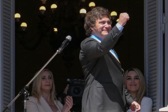 epa11022276 The president of Argentina, Javier Milei, gestures at the end of his speech on the balcony of the Casa Rosada in Buenos Aires, Argentina, 10 December 2023. Milei arrived at the Casa Rosada ...