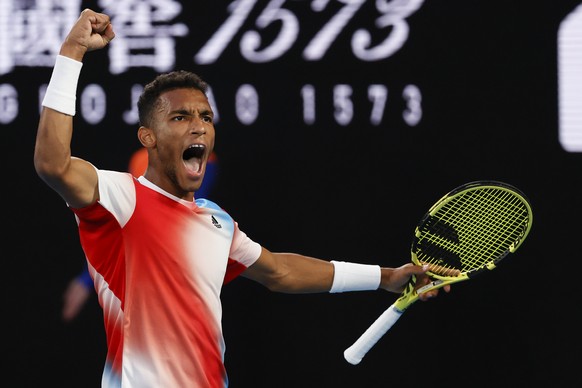 Felix Auger-Aliassime of Canada reacts after winning a point against Daniil Medvedev of Russia during their quarterfinal match at the Australian Open tennis championships in Melbourne, Australia, Wedn ...