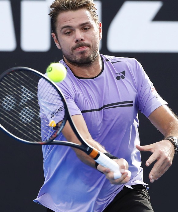 epa07285487 Stan Wawrinka of Switzerland in action during his men&#039;s singles first round match against Ernests Gulbis of Latvia at the Australian Open Grand Slam tennis tournament in Melbourne, Au ...