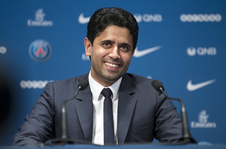 epa06083541 Paris Saint-Germain&#039;s chairman and CEO Nasser Al-Khelaifi smiles as new soccer player Dani Alves is presented during a news conference at the Parc des Princes stadium in Paris, France ...