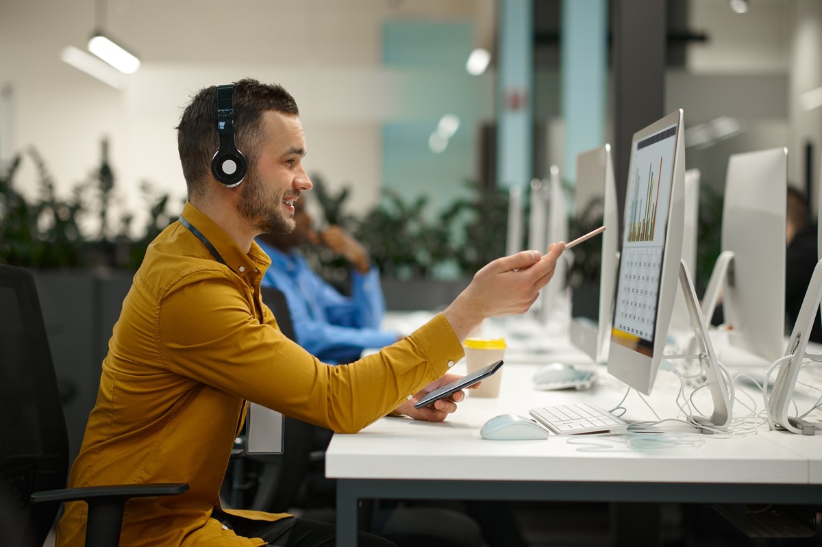 RECORD DATE NOT STATED Male manager in headphones on his workplace, idea developing in IT office. Professional worker, planning or brainstorming. Successful businessman works in modern company. Male m ...