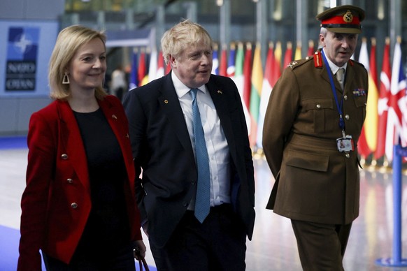 British Prime Minister Boris Johnson, Foreign Secretary Liz Truss and military representative to NATO Ben Bathurst leave NATO Headquarters following a summit on Russia&#039;s invasion of Ukraine in Br ...