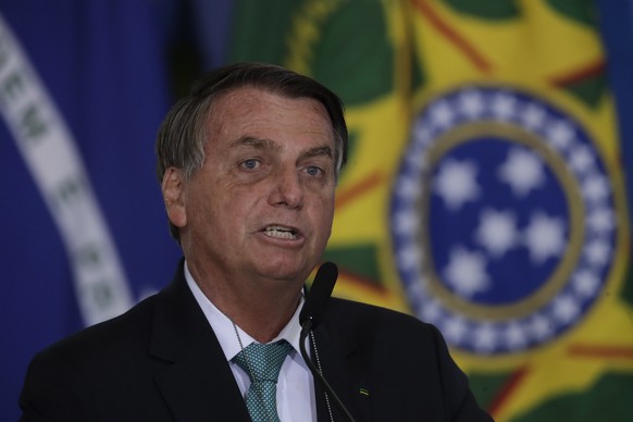 Brazil&#039;s President Jair Bolsonaro confirms his country to host the 2021 Copa America soccer tournament, during a ceremony of the state bank sponsoring Brazilian athletics, at the Planalto preside ...