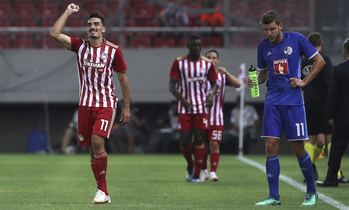 Olympiakos' Lazaros Christodoulopoulos , left, celebrates after scoring his second goal and the second of his side against FC Luzern's during the Europa League third qualifying round , first ...