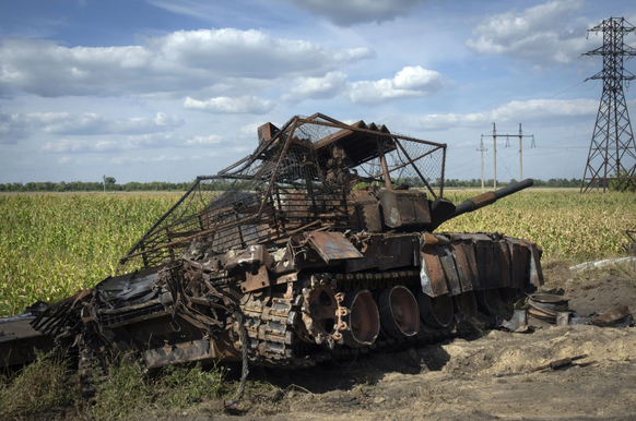FILE - A destroyed Russian tank sits on a roadside near the town of Sudzha, Russia, in the Kursk region, on Aug. 16, 2024. This image was approved by the Ukrainian Defense Ministry before publication. ...