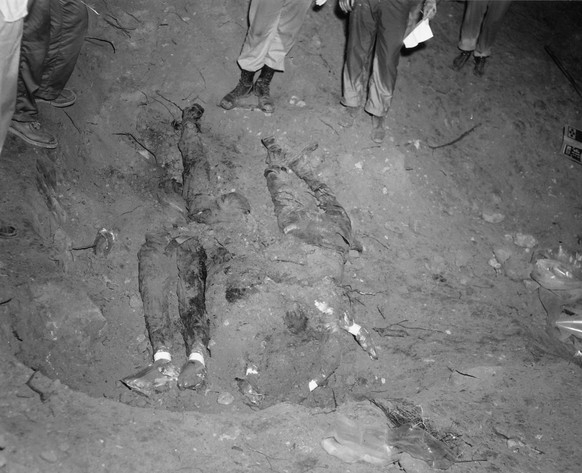 FILE - In this 1964 file photo released by the FBI, the bodies of three civil rights workers are uncovered from an earthen dam southwest of Philadelphia, Miss. The photograph was entered as evidence b ...