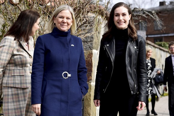 epa09887667 Swedish Prime Minister Magdalena Andersson (L) receives Finnish Prime Minister Sanna Marin prior to a meeting in Stockholm, Sweden, 13 April 2022. The two officials will have talks that ar ...