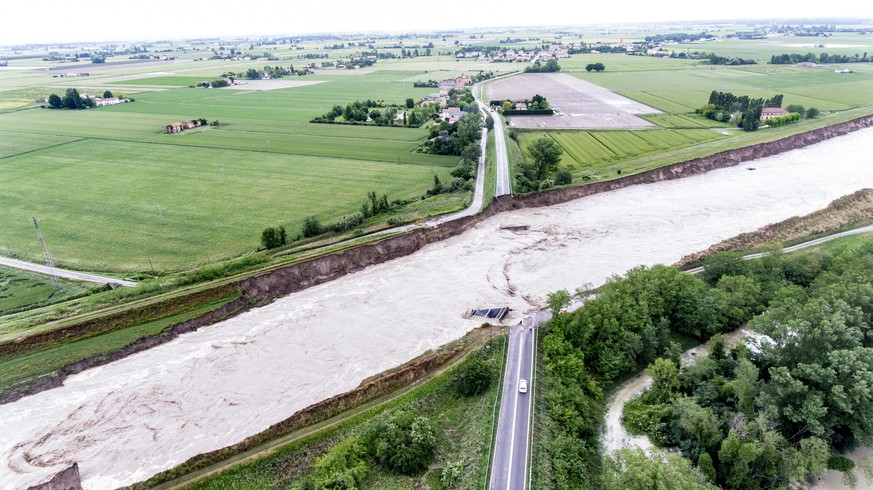 epa10634245 An aerial view on a damaged Motta bridge, which connects the Motta-Budrio with San Martino in Argine, (Bologna) due to the flood of the Idice stream in Budrio, Bologna, Italy, 17 May 2023. ...