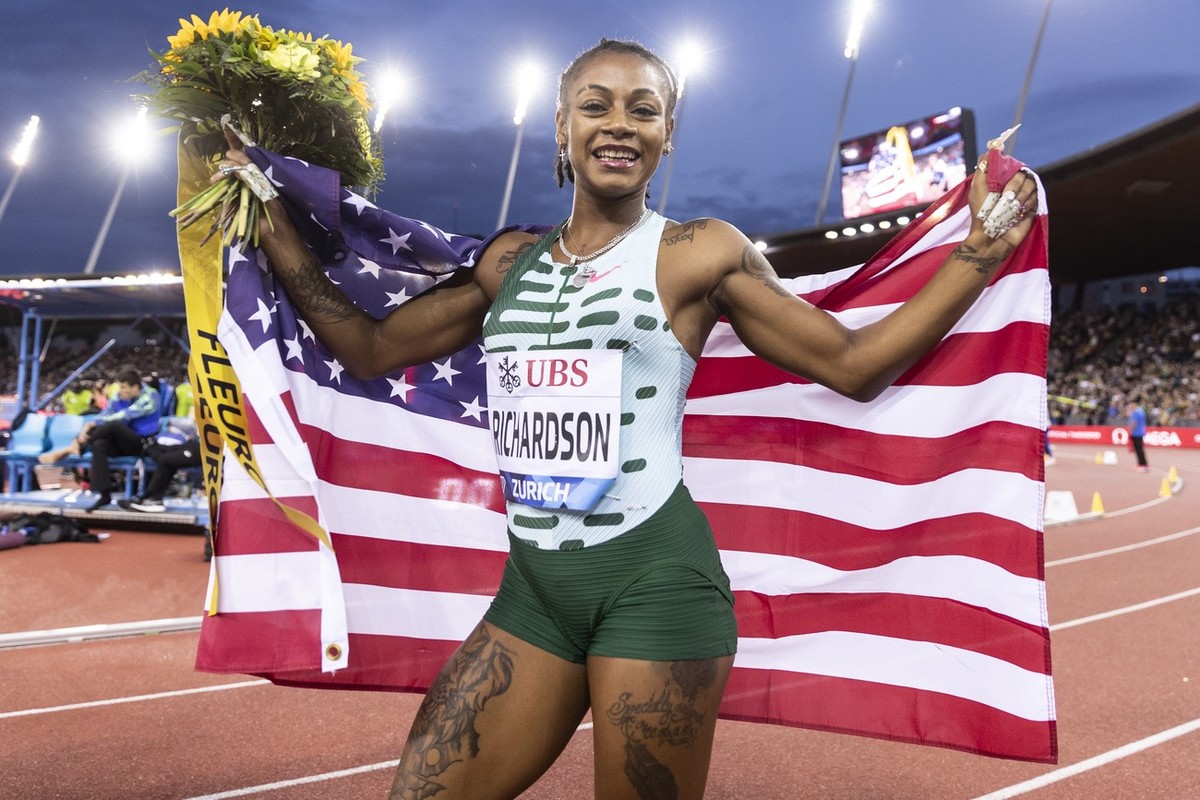 Sha'Carri Richardson of the United States reacts with a US flag as the winner of the 100m Women during the World Athletics Diamond League Weltklasse athletics meeting at the Letzigrund stadium in ...