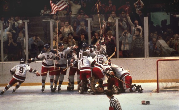 FILE - In this Feb. 22, 1980, file photo, the U.S. hockey team pounces on goalie Jim Craig after a 4-3 victory against the Soviets in the 1980 Olympics in Lake Placid, N.Y. If the NHL doesn’t send its ...