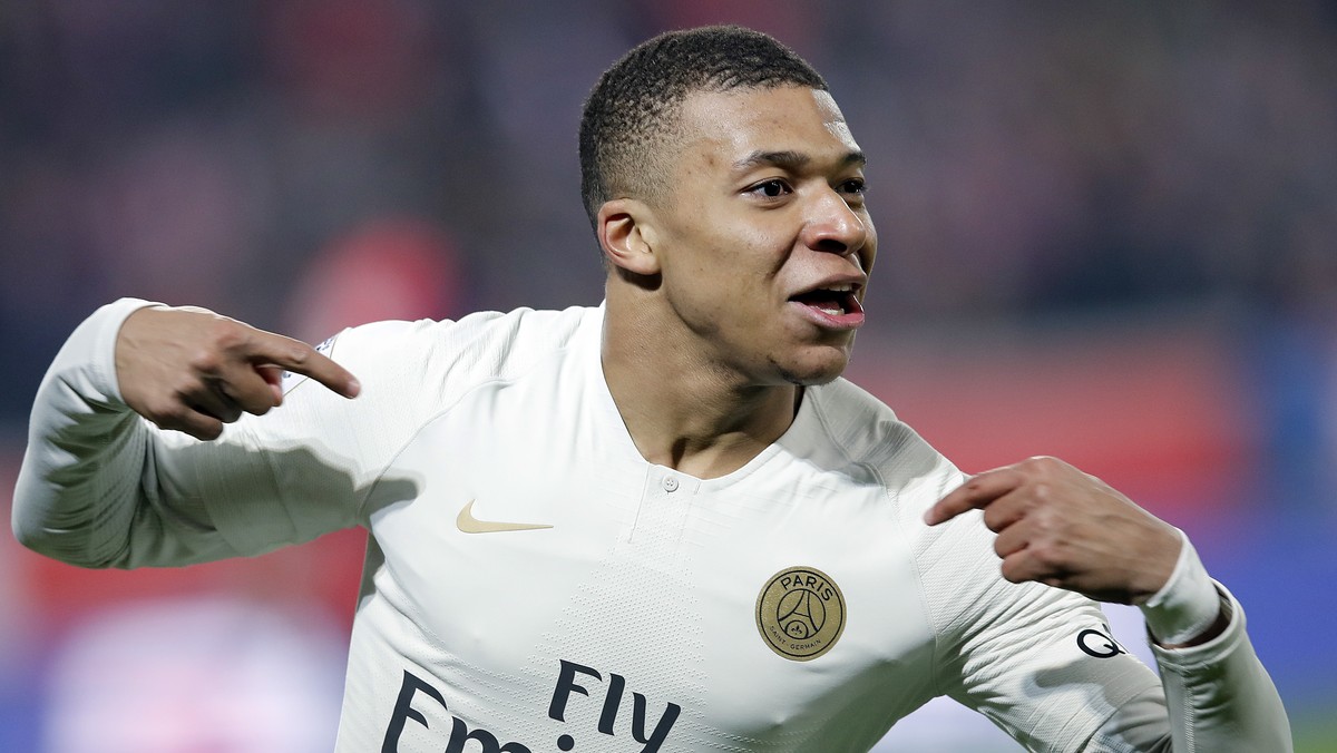 FILE - In this April 14, 2019 file photo, PSG's Kylian Mbappe celebrates after his team scored during the French League One soccer match between OSC Lille and Paris Saint-Germain at Stade Pierre  ...