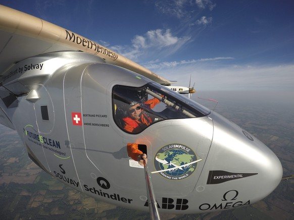 epa05329379 A handout picture made available on 26 May 2016 shows Swiss adventurer and pilot Bertrand Piccard talking an extreme self portait during the flight of Solar Impulse 2 (Si2) to Lehigh Valle ...