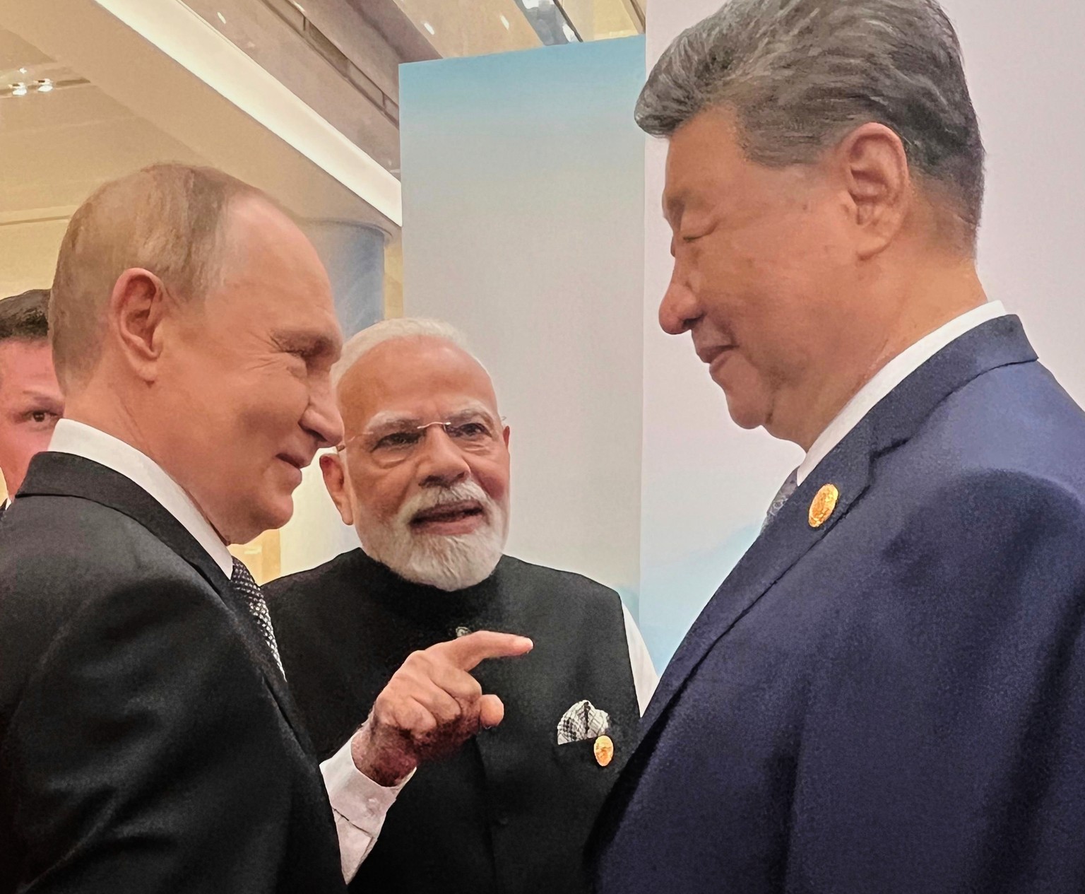 Russian President Vladimir Putin, from left, Indian Prime Minister Narendra Modi and Chinese President Xi Jinping talk ahead of the Shanghai Cooperation Organization (SCO) summit at the Meijiang Conve ...