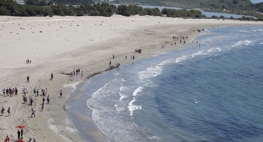 epa13020359 Protestors march in the area planned for the coastal resort project linked to Jared Kushner, son-in-law of US President Donald Trump near Vlora, Albania, 06 June 2026. The project has face ...