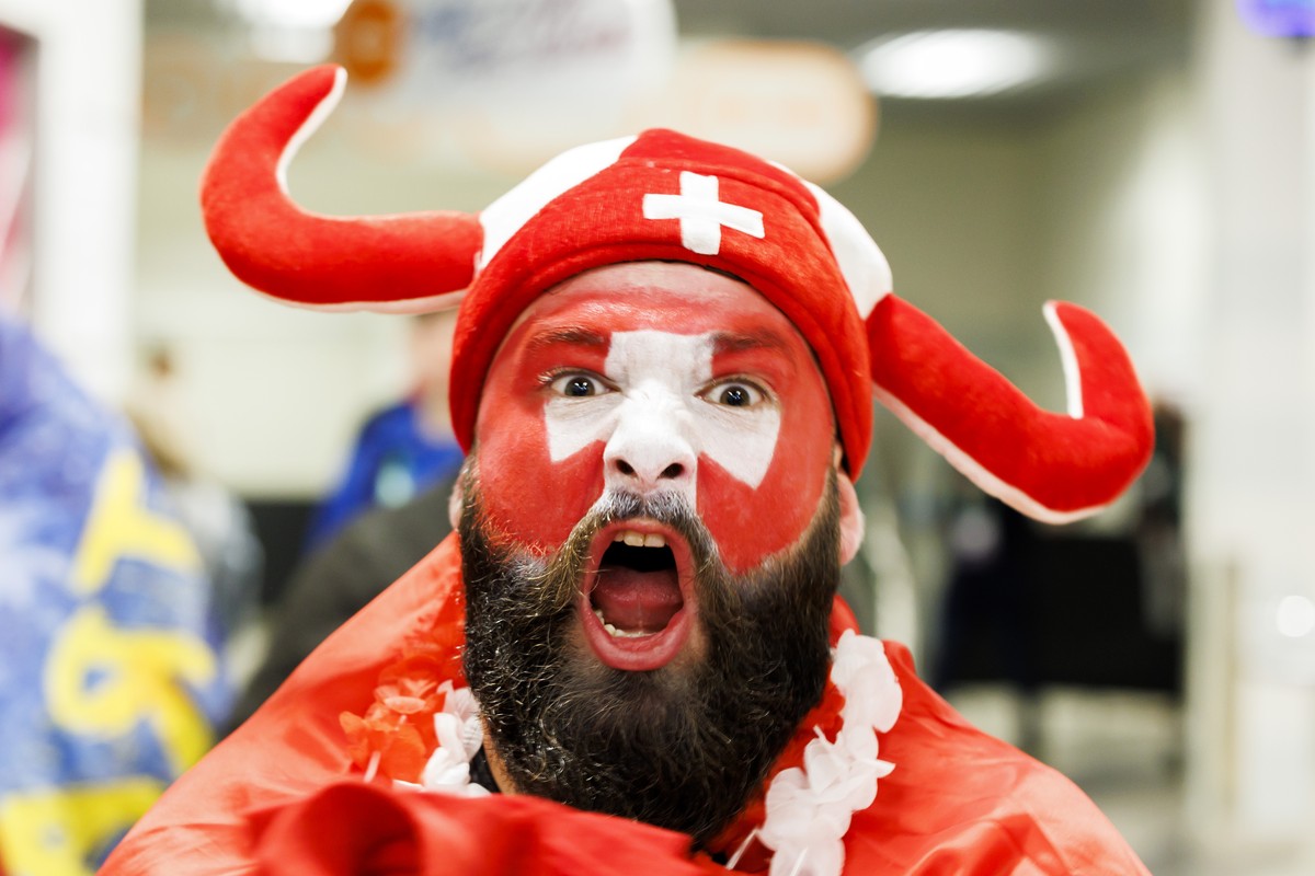 A Swiss supporter celebrates the victory after the Switzerland team defeating the team Slovakia, during the IIHF 2023 World Championship preliminary round group B game between Switzerland and Slovakia ...