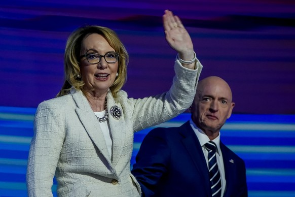epa11560767 Former Arizona US Representative Gabrielle Giffords (L) and her husband, Arizona US Senator Mark Kelly (R), attend the final night of the Democratic National Convention (DNC) at the United ...