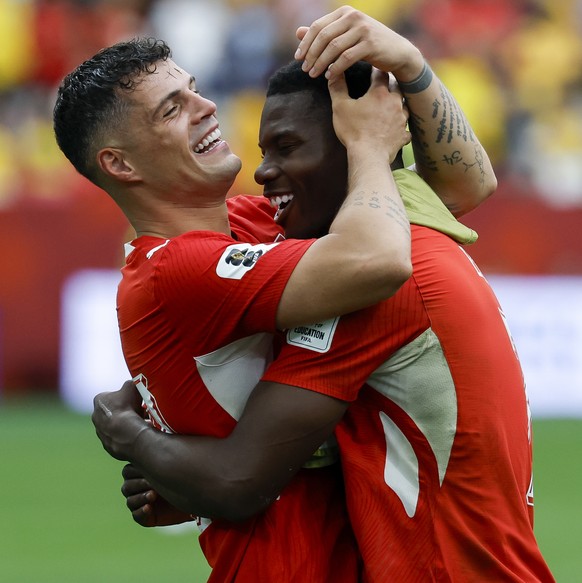epa13096807 Switzerland's Granit Xhaka (L) and Breel Embolo celebrate winning the FIFA World Cup 2026 Round of 16 match Switzerland against Colombia, in Vancouver, Canada, 07 July 2026. EPA/PETER ...