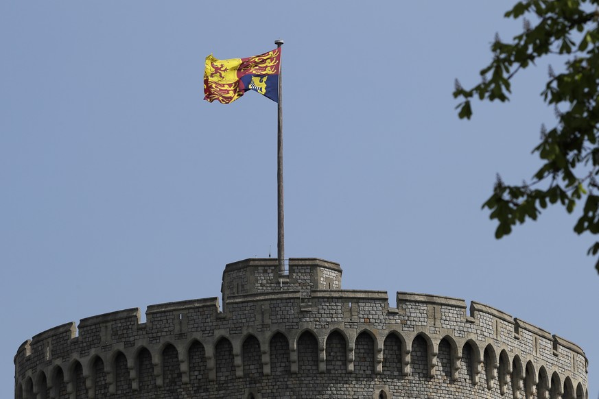 FILE - In this file photo dated Wednesday, April 21, 2021, The Royal Standard flies above Windsor Castle in Windsor, England. Buckingham Palace said Thursday June 3, 2021, that Queen Elizabeth II will ...