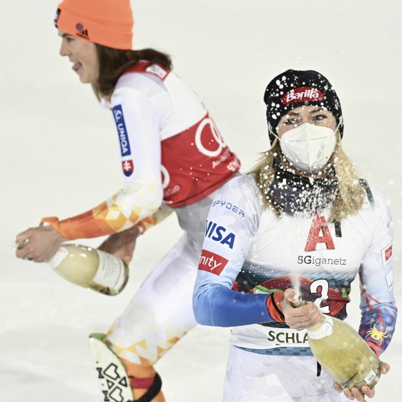 epa09679423 Winner Mikaela Shiffrin (R) of the USA and second placed Petra Vlhova (L) of Slovakia celebrate after the women&#039;s Slalom race of the FIS Alpine Skiing World Cup event in Schladming, A ...