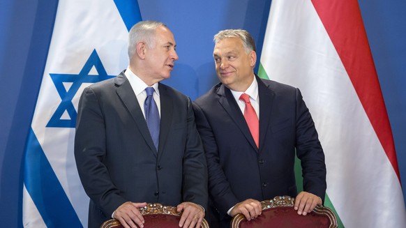 FILE - Israeli Prime Minister Benjamin Netanyahu, left, and his Hungarian counterpart Viktor Orban chat as they attend a signing ceremony in the Parliament building in Budapest, Hungary, Tuesday, July ...