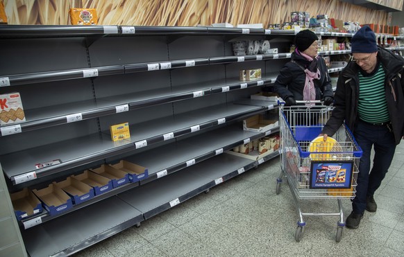 epa08292635 People shop in a supermarket in Vantaa, Finland, 13 March 2020. Panic buying has started in Finland where people try to brace for an outbreak of the pandemic coronavirus. EPA/MAURI RATILAI ...