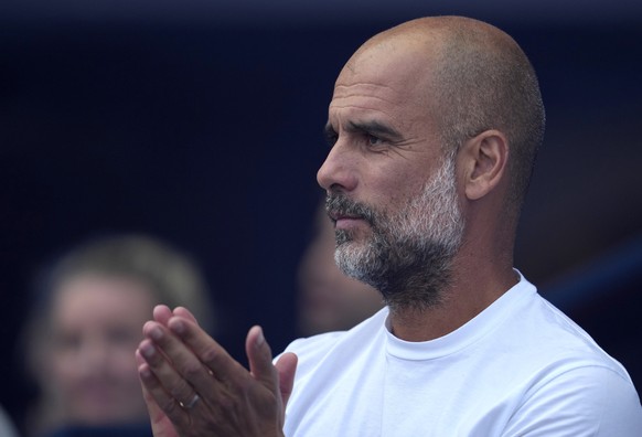 Manchester City&#039;s head coach Pep Guardiola applauds before the English Premier League soccer match between Manchester City and Bournemouth at Etihad stadium in Manchester, England, Saturday, Aug. ...