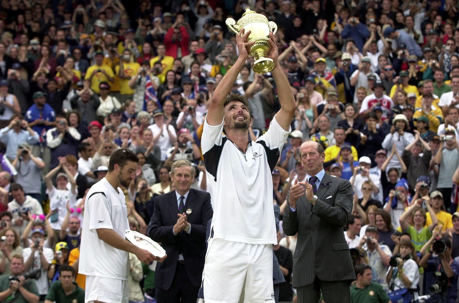 9 Jul 2001: Goran Ivanisevic of Croatia lifts the Wimbledon trophy after beating Patrick Rafter of Australia during the Men&#039;s Final of The All England Lawn Tennis Championship at Wimbledon, Londo ...