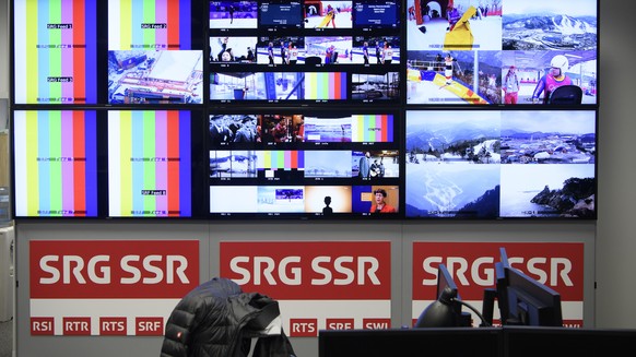 Screens of Swiss broadcaster SRG SSR are pictured during a media visit of the International Broadcasting Center (IBC) the day of the opening of the XXIII Winter Olympics 2018 in Pyeongchang, South Kor ...