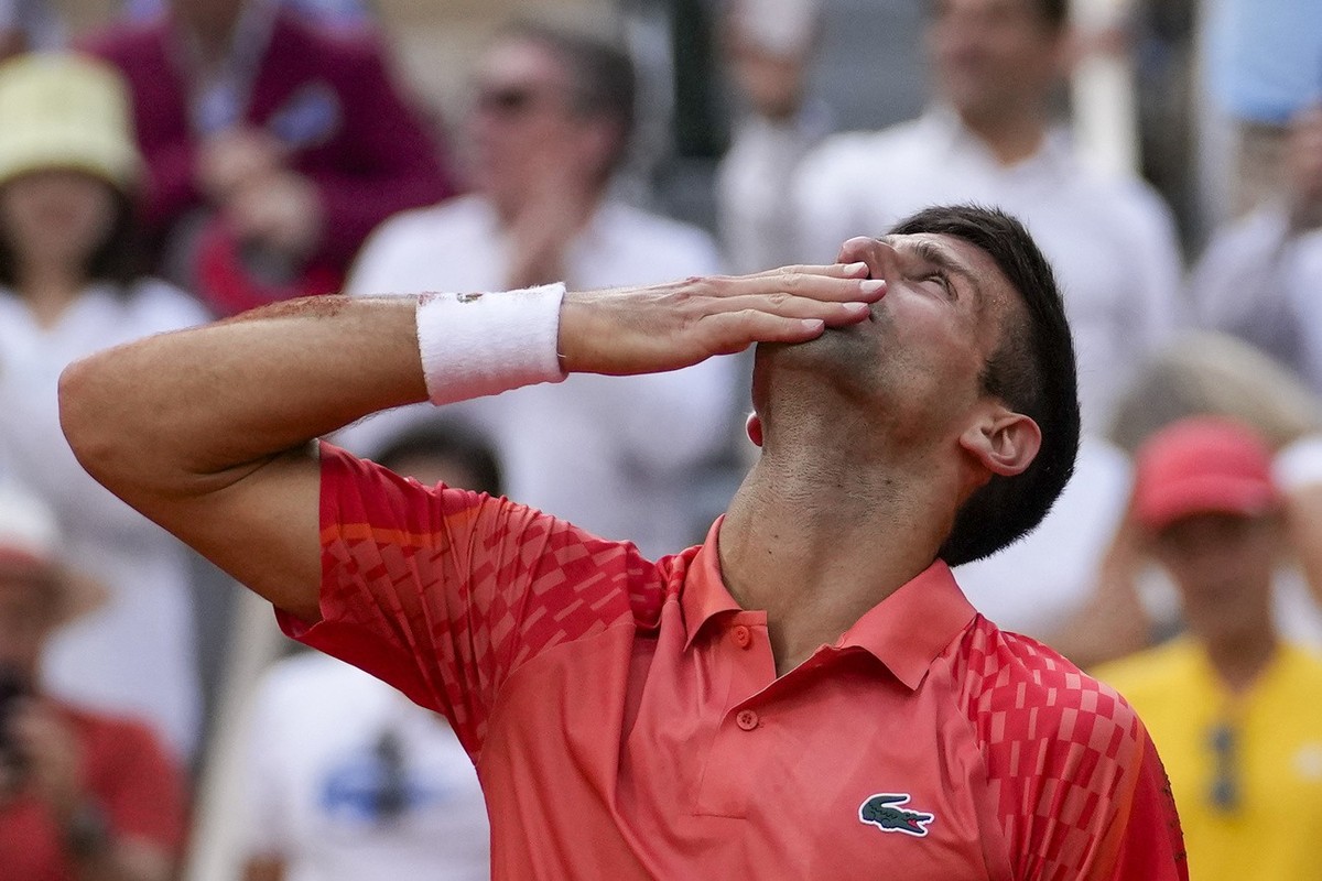 Serbia's Novak Djokovic celebrates winning the men's singles final match of the French Open tennis tournament against Norway's Casper Ruud in three sets, 7-6, (7-1), 6-3, 7-5, at the Ro ...