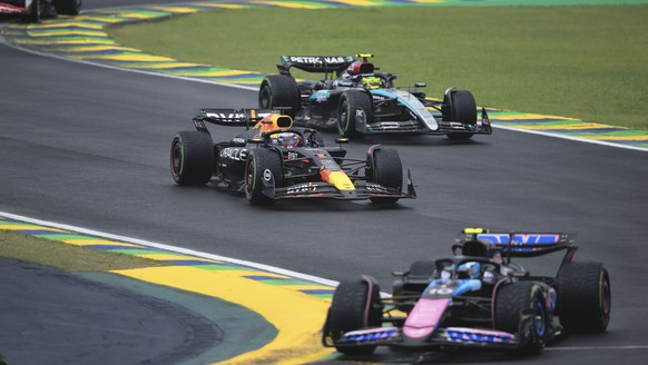 Red Bull driver Max Verstappen of the Netherlands, center, steers his car during the Brazilian Formula One Grand Prix at the Interlagos race track, in Sao Paulo, Brazil, Sunday, Nov. 3, 2024. (AP Phot ...