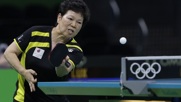 Xialian Ni of Luxembourg plays against Yanfei Shen of Spain during their table tennis match at the 2016 Summer Olympics in Rio de Janeiro, Brazil, Sunday, Aug. 7, 2016.(AP Photo/Petros Giannakouris)