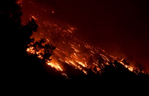 epa10765116 A wildfire burns at the Trapeza village, in Achaia Peloponnese, Greece, 23 July 2023. There is an extreme, category 5, fire risk high alert also for 24 July, for five Greek regions of Atti ...