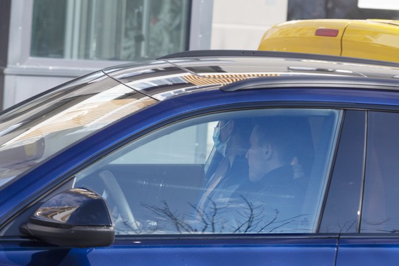 Novak Djokovic, back, and his brother Djordje are seen inside a vehicle in Belgrade, Serbia, Monday, Jan. 17, 2022. Djokovic arrived in his native Serbia on Monday after being deported from Australia  ...