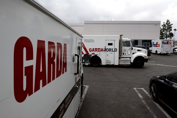 Armored trucks are parked outside the offices of GardaWorld in the Sylmar section of Los Angeles on Thursday, April 4, 2024. Thieves stole as much $30 million in an Easter Sunday burglary at a Los Ang ...