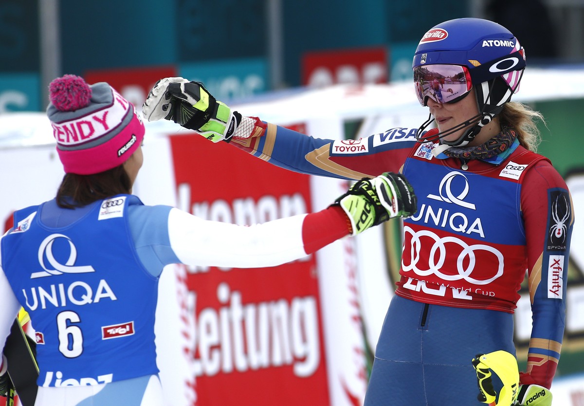 First placed United States' Mikaela Shiffrin, right, celebrates with second placed Switzerland's Wendy Holdener at the end of the final run of an alpine ski, women's World Cup slalom, i ...