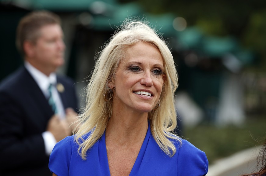 FILE - In this July 27, 2017, file photo, Counselor to the President Kellyanne Conway walks back to the West Wing of the White House in Washington. A federal watchdog says Conway violated the federal  ...