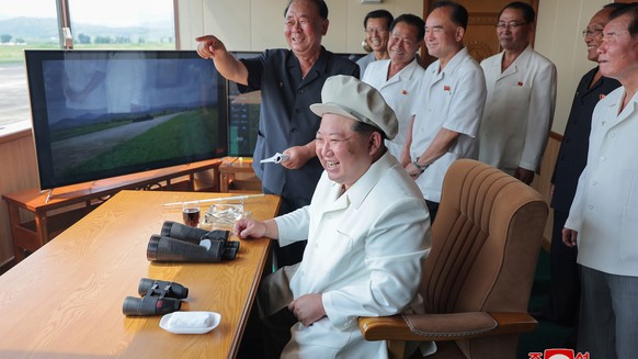 epa11564973 A photo released by the official North Korean Central News Agency (KCNA) shows North Korean leader Kim Jong Un overseeing a performance test of various drones during a visit to the Drone I ...