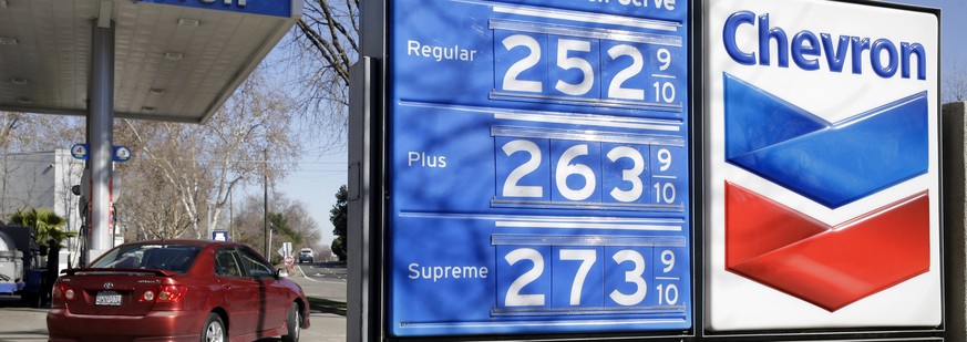 FILE - In this Monday, Feb. 8, 2016, file photo, gas prices are displayed at a Chevron gas station in Sacramento, Calif. Chevron reports financial results Friday, April 29, 2016. (AP Photo/Rich Pedron ...