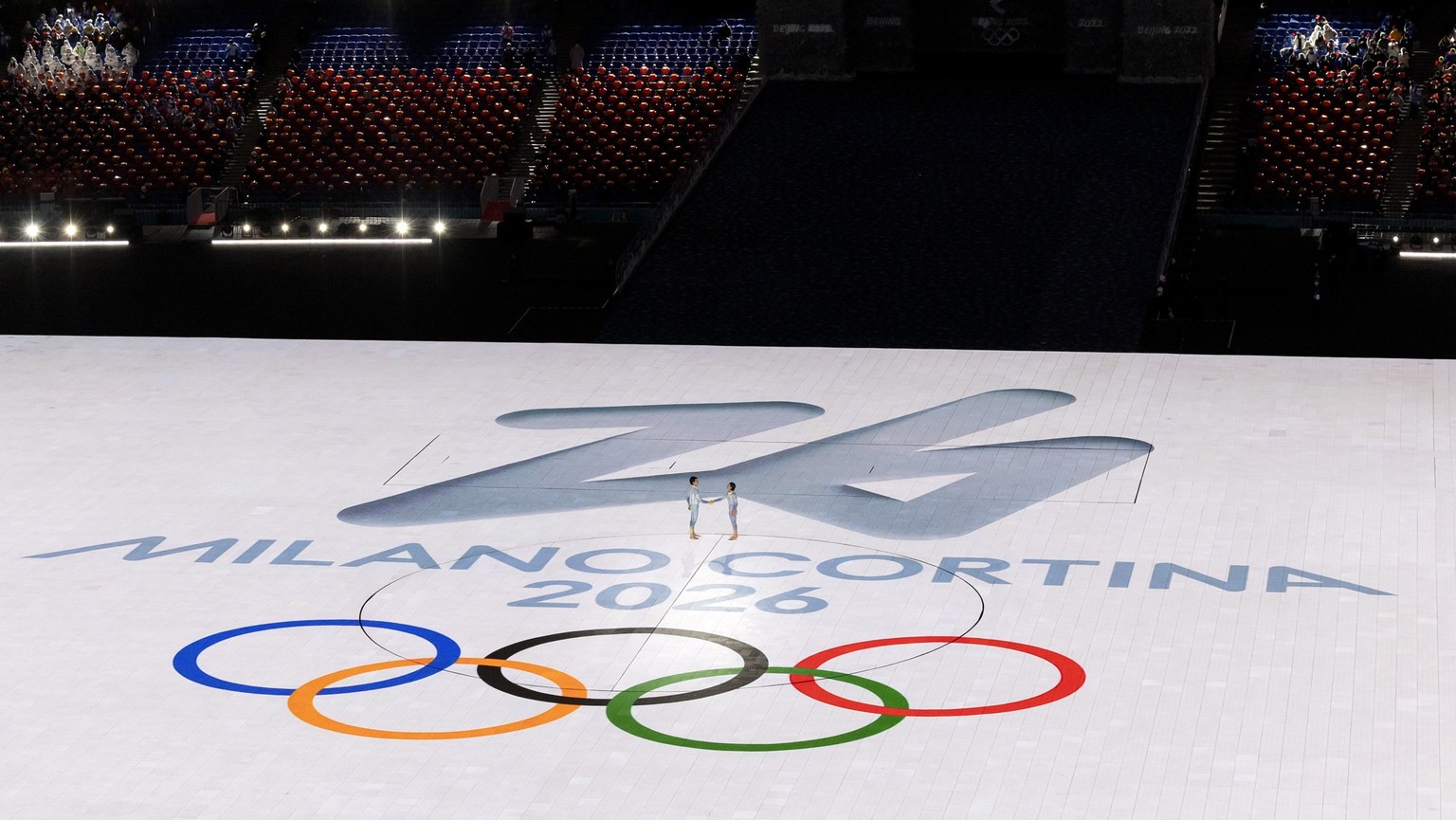 Dancers perform on logo of Milano Cortina during a segment dedicated to the Milan Cortina 2026 Winter Olympic Games during the closing ceremony of the 2022 Olympic Winter Games in the National Stadium ...