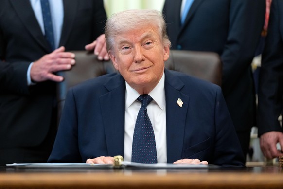President Donald Trump listens during an event on health care affordability in the Oval Office at the White House, Thursday, April 23, 2026, in Washington. (AP Photo/Mark Schiefelbein)
Donald Trump