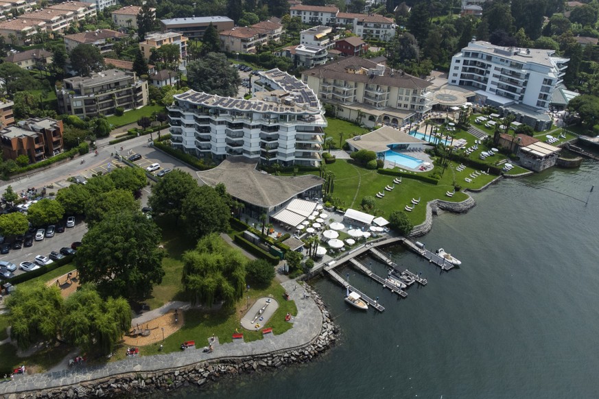An aerial view of the Ascona hotel area, with the Hotel Eden Roc in the foreground overlooking the shore of Lake Maggiore, the path along the lakeshore called ?Sentiero delle rive? is part of an agree ...